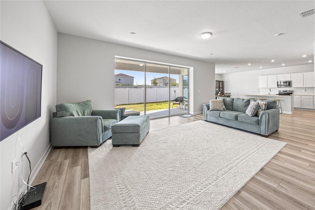 4472 Southwest 84th St Road Ocala, FL 34476 - Photo 16 of 50 a living room with furniture and a large window