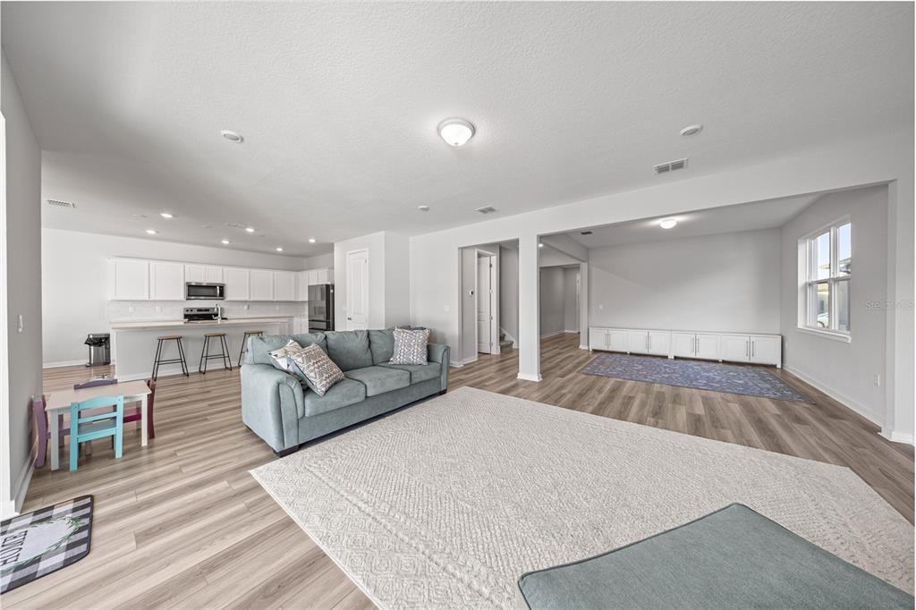 4472 Southwest 84th St Road Ocala, FL 34476 - Photo 17 of 50 a living room with furniture and a wooden floor