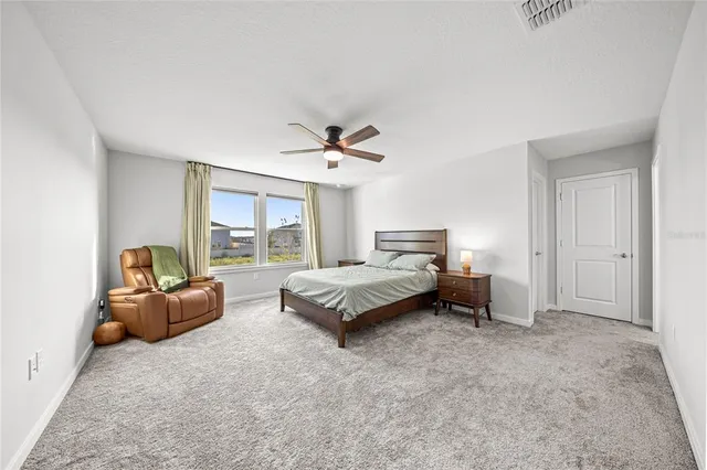 a bed room with a bed and a couch