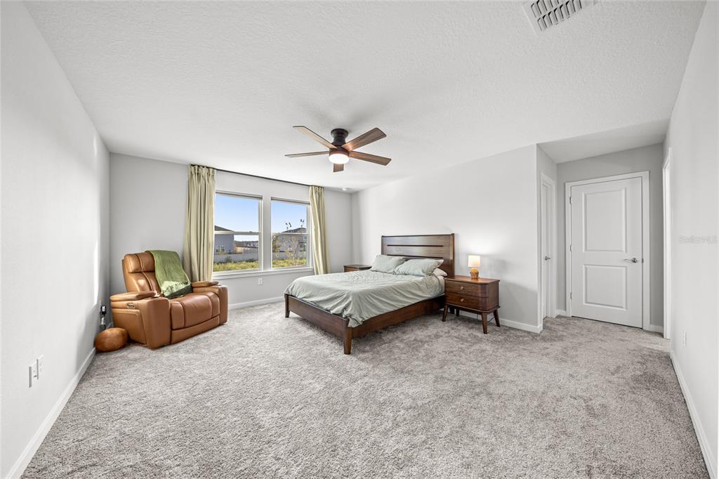 4472 Southwest 84th St Road Ocala, FL 34476 - Photo 26 of 50 a living room with furniture and a large window