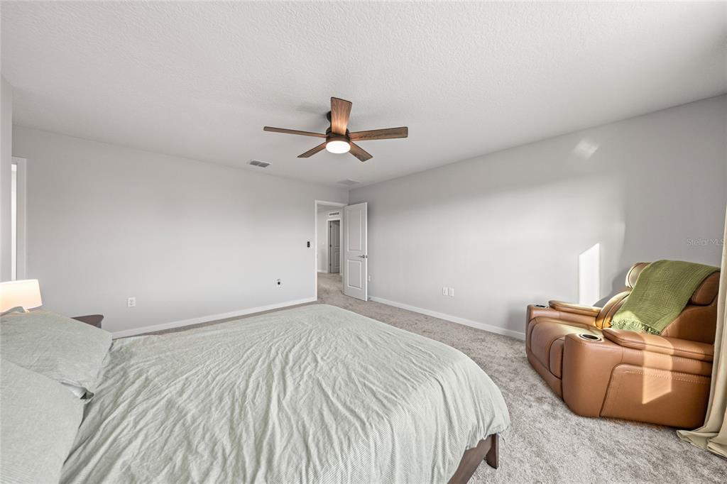 4472 Southwest 84th St Road Ocala, FL 34476 - Photo 27 of 50 a bed room with a bed and a couch