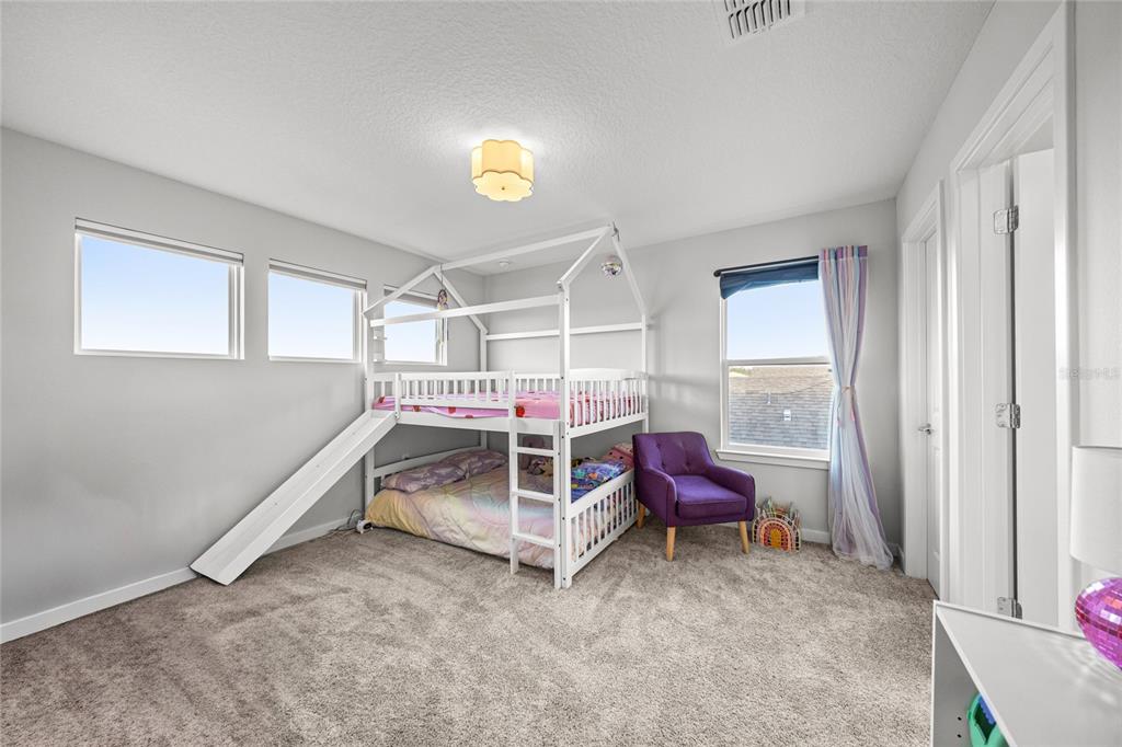 4472 Southwest 84th St Road Ocala, FL 34476 - Photo 35 of 50 a bedroom with furniture and a window