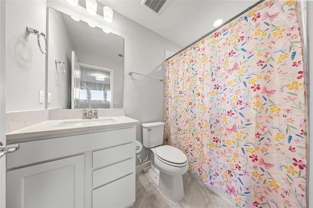 a view of a storage and utility room with washer and dryer