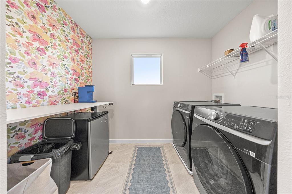 4472 Southwest 84th St Road Ocala, FL 34476 - Photo 38 of 50 a view of a storage and utility room with washer and dryer