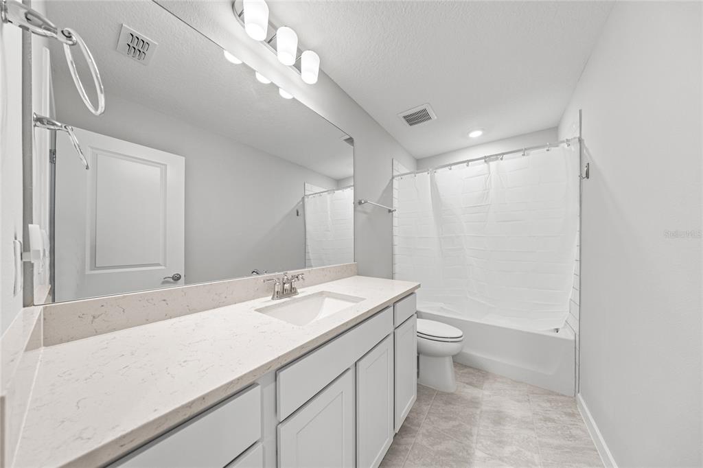 4472 Southwest 84th St Road Ocala, FL 34476 - Photo 39 of 50 a bathroom with a sink a toilet and shower