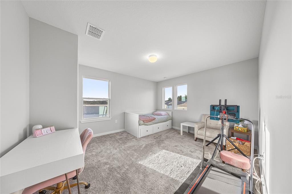 4472 Southwest 84th St Road Ocala, FL 34476 - Photo 40 of 50 a living room with furniture and a window