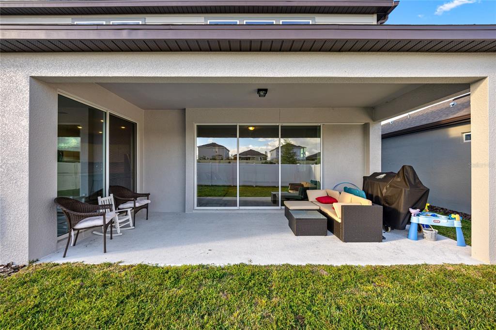 4472 Southwest 84th St Road Ocala, FL 34476 - Photo 42 of 50 a building outdoor space with patio furniture and potted plants