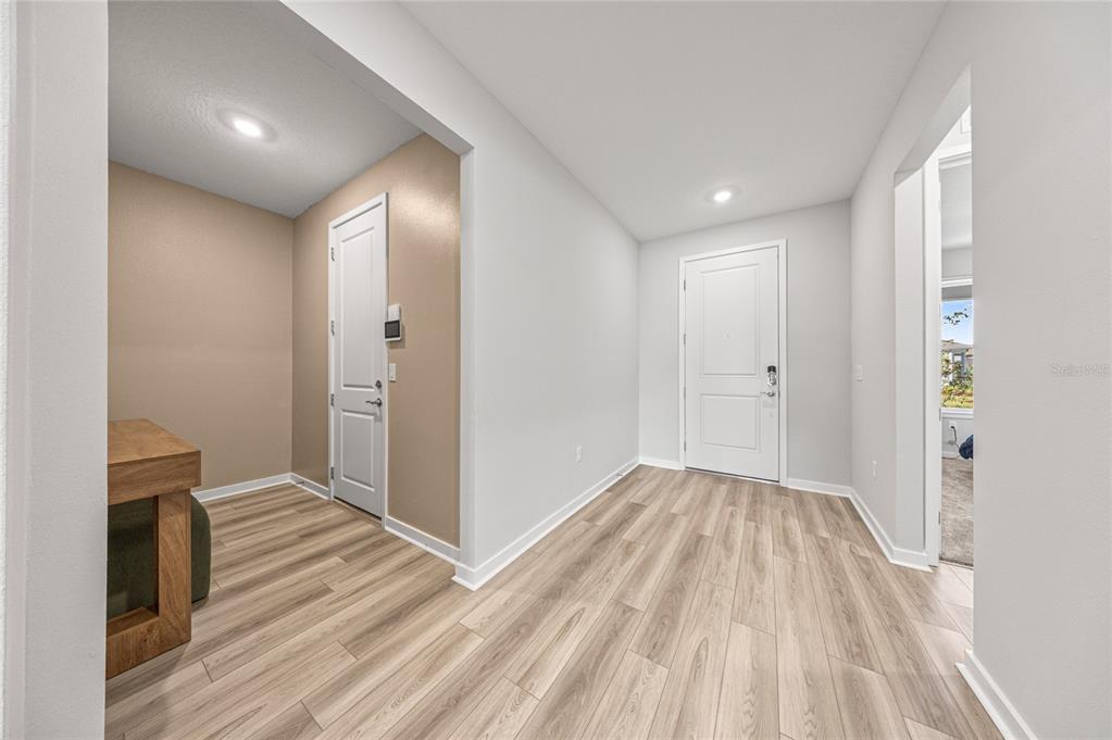 4472 Southwest 84th St Road Ocala, FL 34476 - Photo 7 of 50 a view of hallway with wooden floor