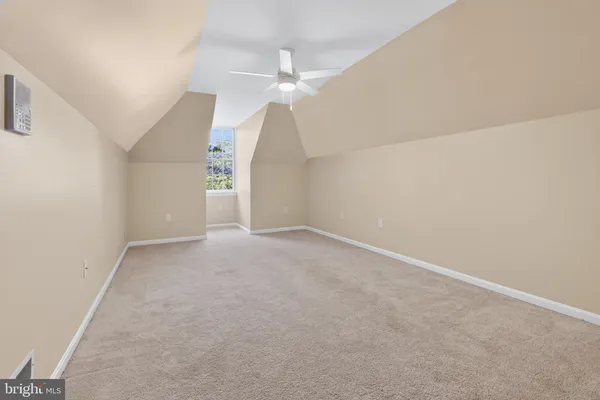 a kitchen with stainless steel appliances granite countertop a refrigerator a sink and a stove