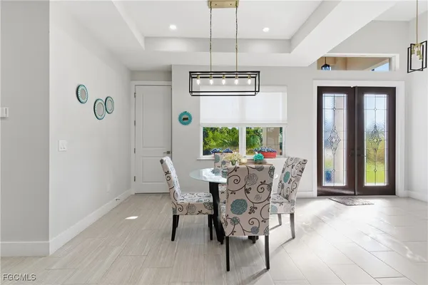 a view of a dining room with furniture window and outside view