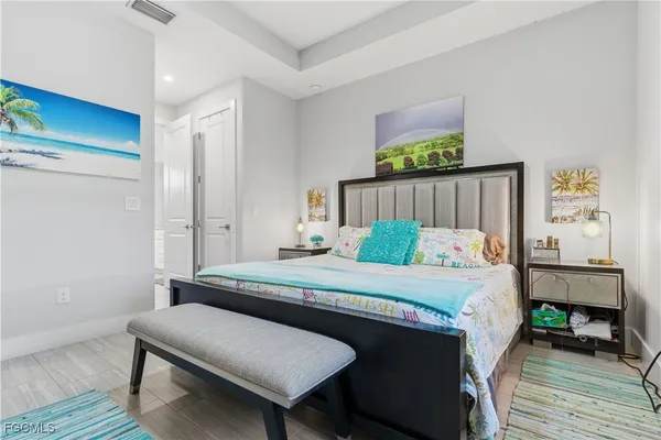 a bedroom with a bed and a table in it