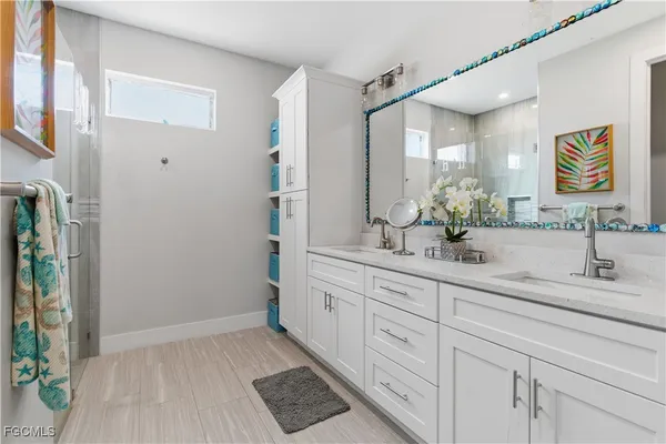 a bathroom with a sink and a mirror