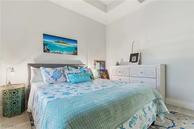 a bedroom with a bed and a cabinets