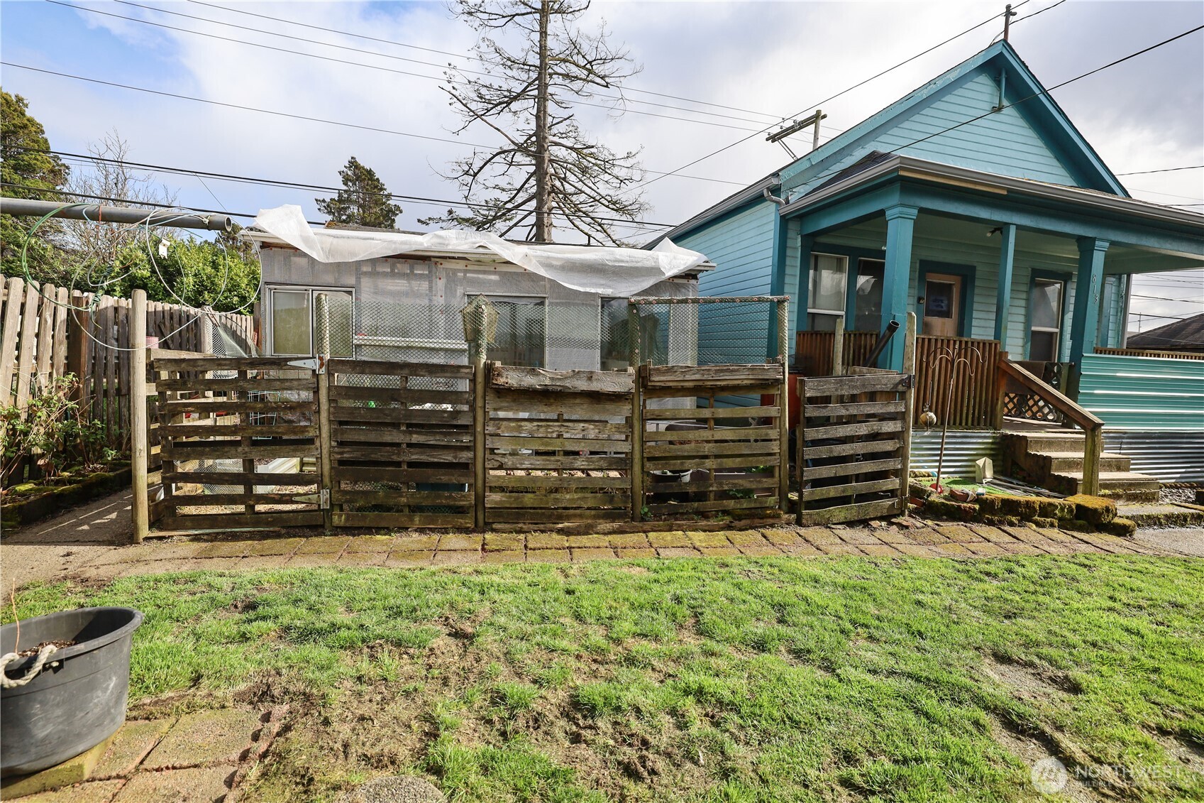 811 West Market Street Aberdeen, WA 98520 - Photo 24 of 35 a view of a house with a small yard and wooden fence
