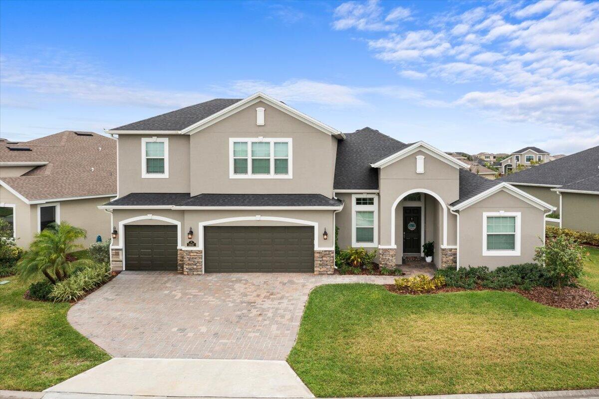 3447 Caviston Way Melbourne, FL 32940 - Photo 1 of 57 a front view of a house with a yard and garage