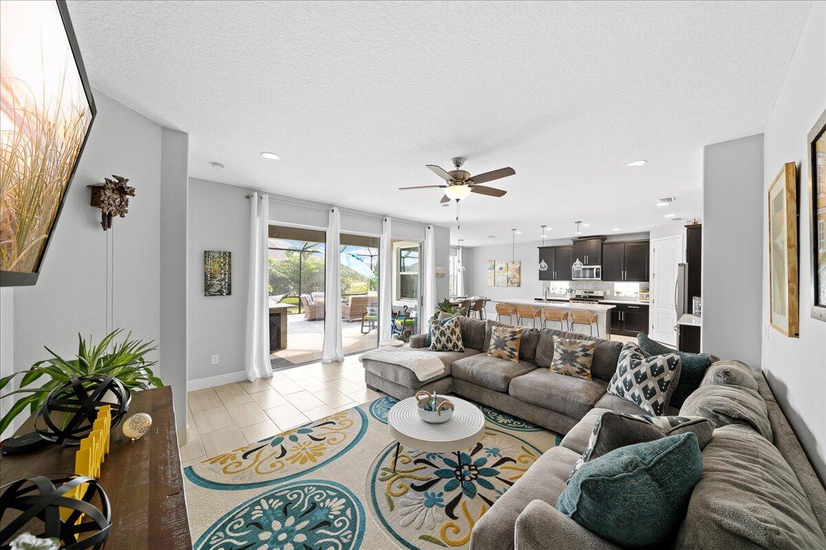 3447 Caviston Way Melbourne, FL 32940 - Photo 11 of 57 a living room with furniture and a large window