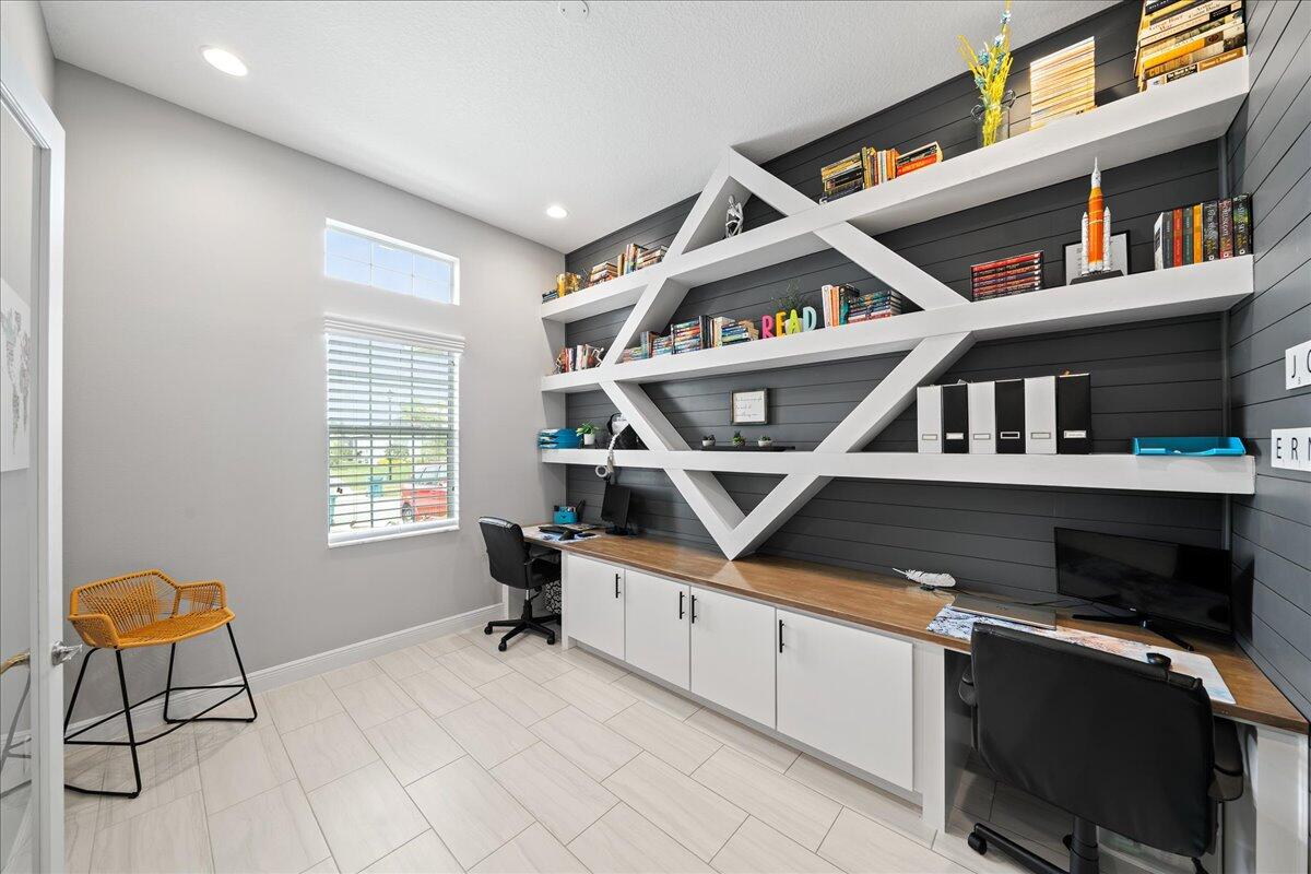 3447 Caviston Way Melbourne, FL 32940 - Photo 12 of 57 a workspace with furniture pool table and windows