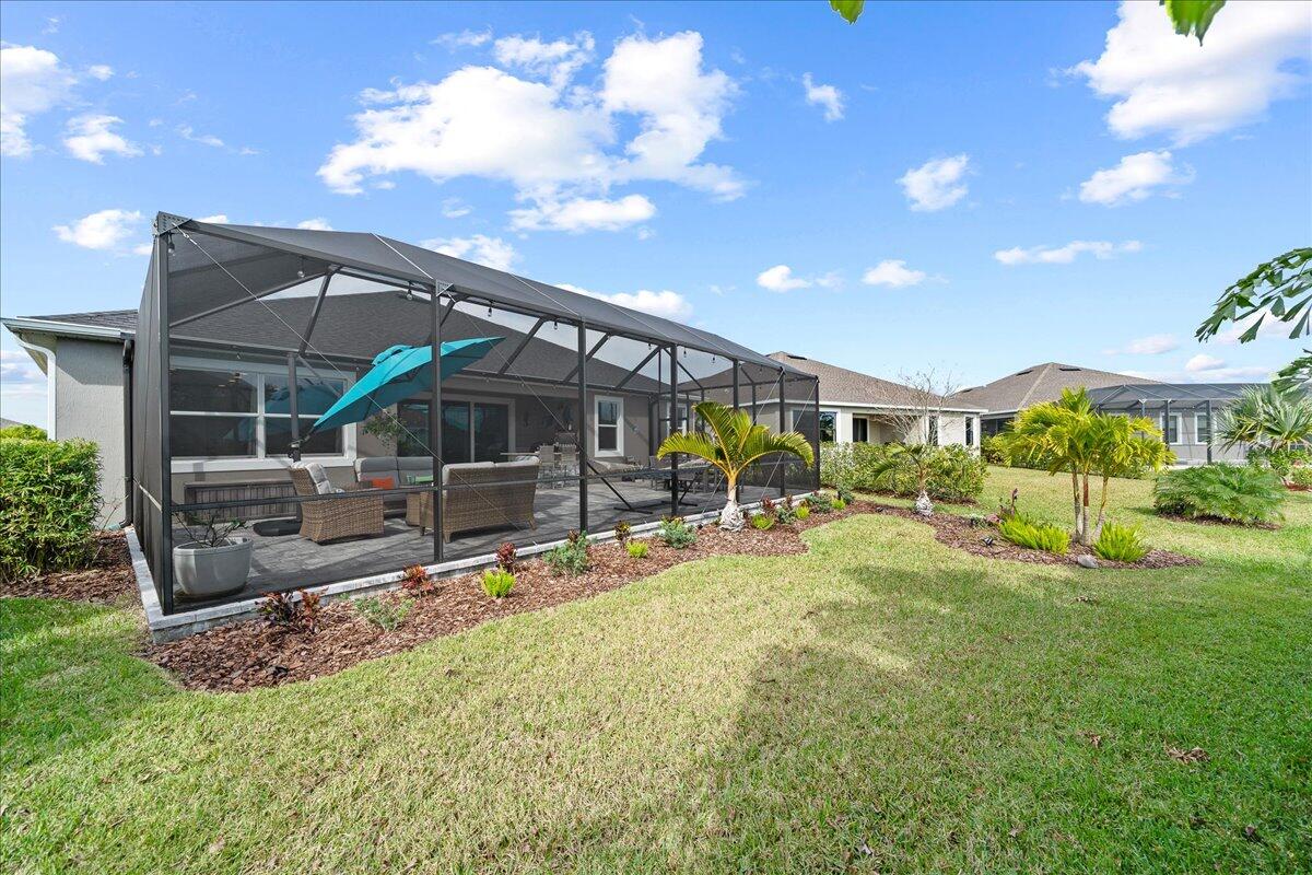 3447 Caviston Way Melbourne, FL 32940 - Photo 33 of 57 a view of a house with backyard porch and sitting area