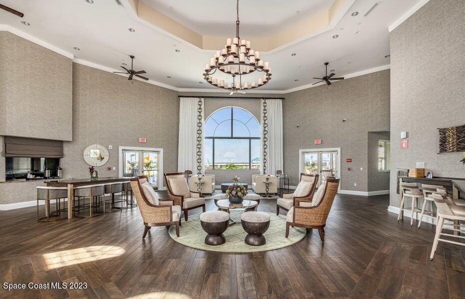 3447 Caviston Way Melbourne, FL 32940 - Photo 47 of 57 a view of a dining room with furniture wooden floor and chandelier