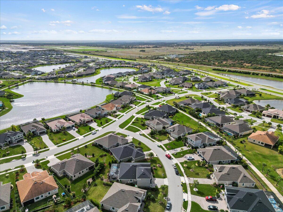 3447 Caviston Way Melbourne, FL 32940 - Photo 54 of 57 an aerial view of residential houses with outdoor space