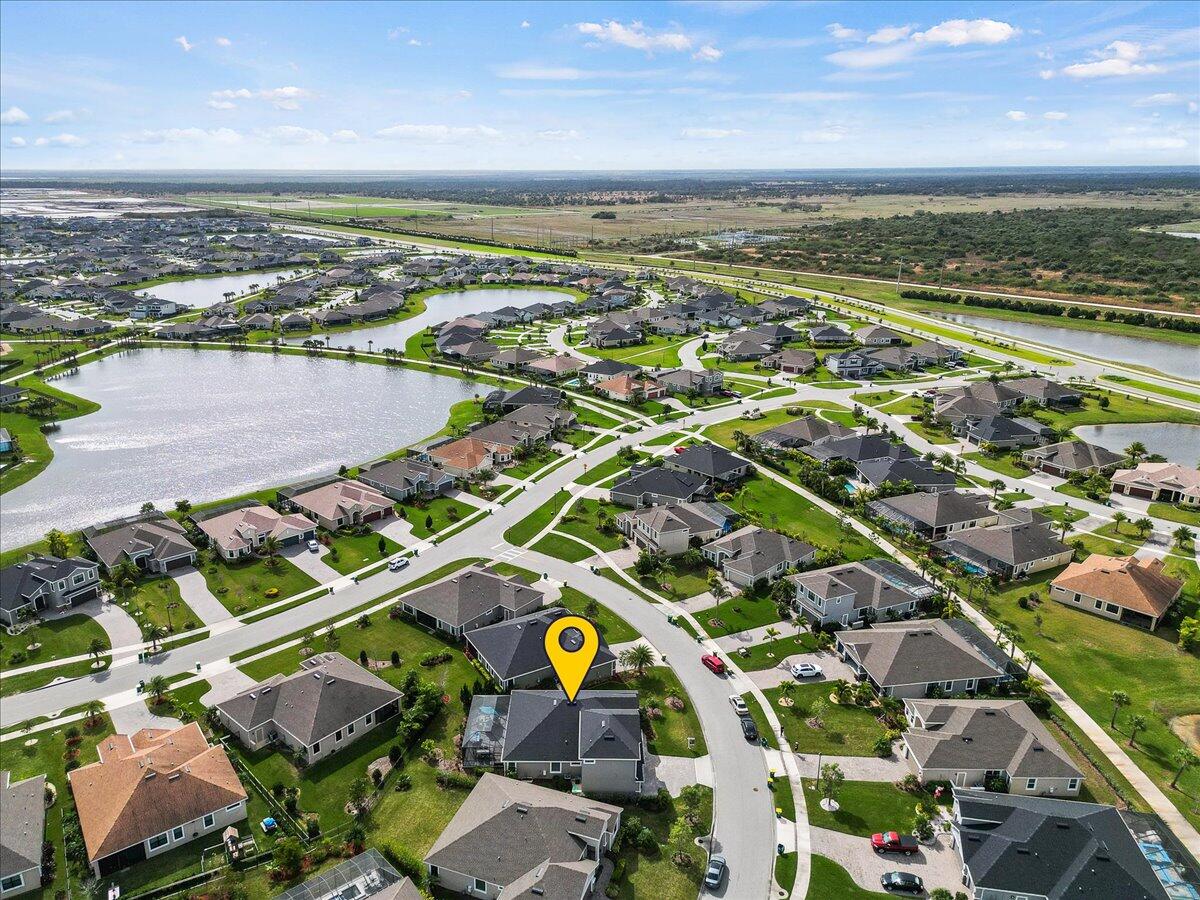 3447 Caviston Way Melbourne, FL 32940 - Photo 57 of 57 an aerial view of residential houses with outdoor space