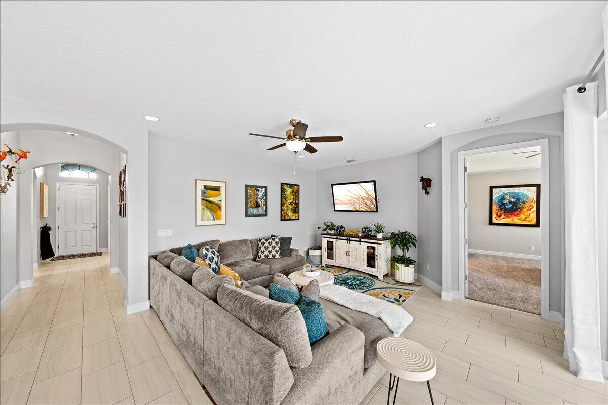 3447 Caviston Way Melbourne, FL 32940 - Photo 10 of 57 a living room with furniture and a table