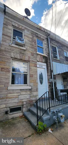 a front view of a house with parking space