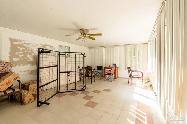 a view of a livingroom with wooden floor and a flat screen tv