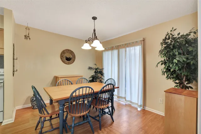 a very nice looking dining room with a table and chairs