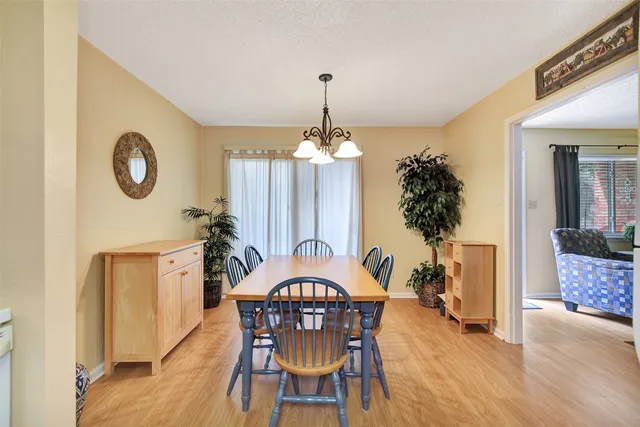 a view of a hallway with living room and furniture