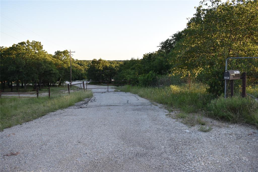 1341 Hildreth Pool Road Bowie, TX 76230 - Photo 3 of 40 a view of a road with a yard