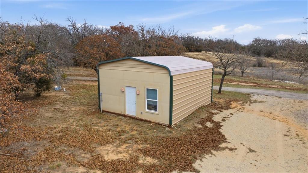 1341 Hildreth Pool Road Bowie, TX 76230 - Photo 35 of 40 a view of a house with a yard
