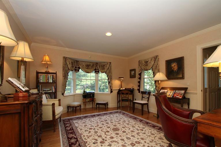 29 Farm Valley Road Osterville, MA 02655 - Photo 12 of 24 a living room with furniture fireplace and a flat screen tv