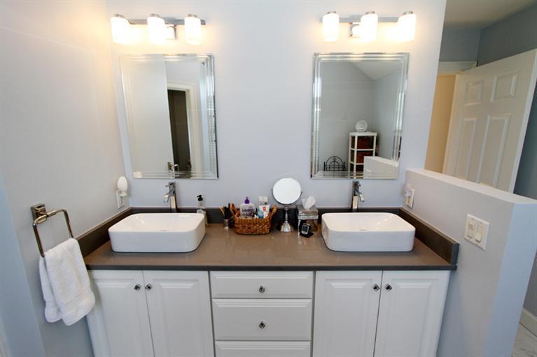 29 Farm Valley Road Osterville, MA 02655 - Photo 17 of 24 a bathroom with double vanity sinks and a mirror