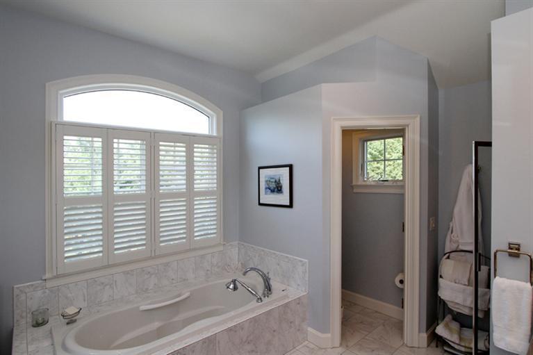29 Farm Valley Road Osterville, MA 02655 - Photo 18 of 24 a bathroom with a tub and a window