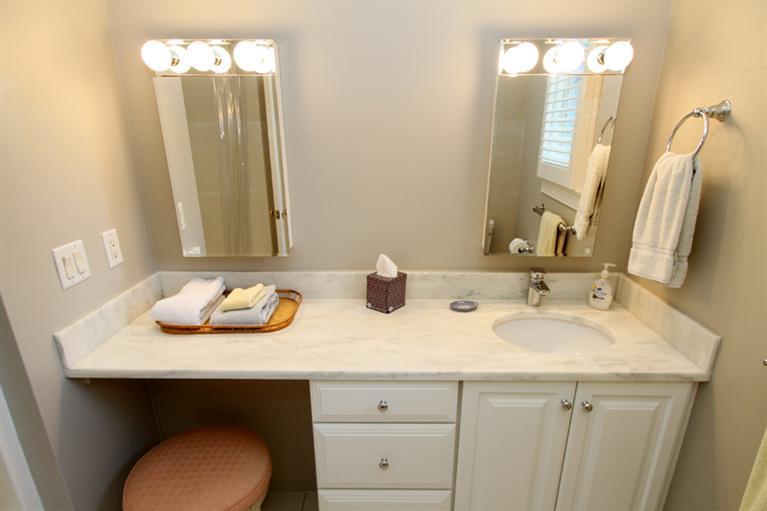 29 Farm Valley Road Osterville, MA 02655 - Photo 21 of 24 a bathroom with a sink and a mirror