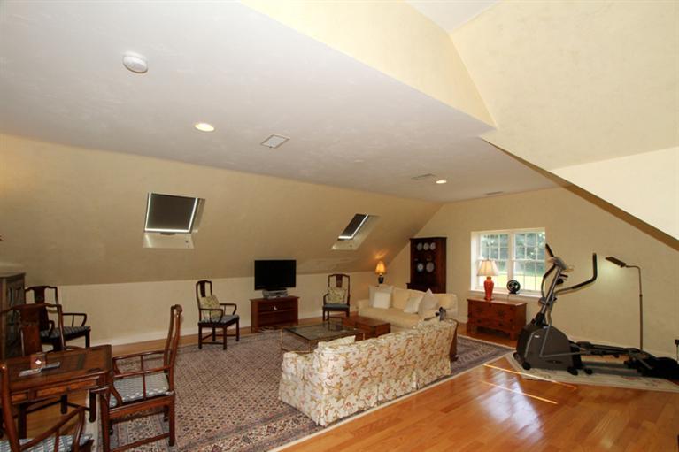 29 Farm Valley Road Osterville, MA 02655 - Photo 23 of 24 a living room with furniture gym equipment and a flat screen tv