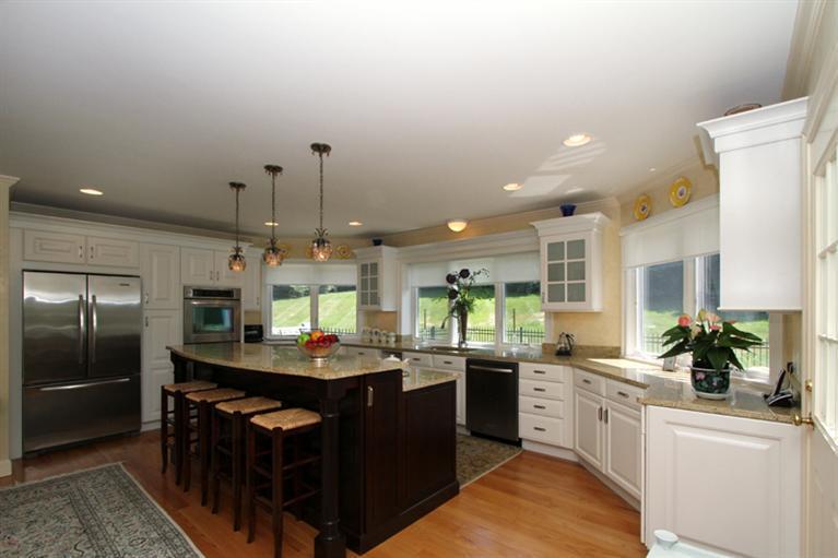 29 Farm Valley Road Osterville, MA 02655 - Photo 5 of 24 a kitchen with stainless steel appliances granite countertop a sink a stove and a refrigerator