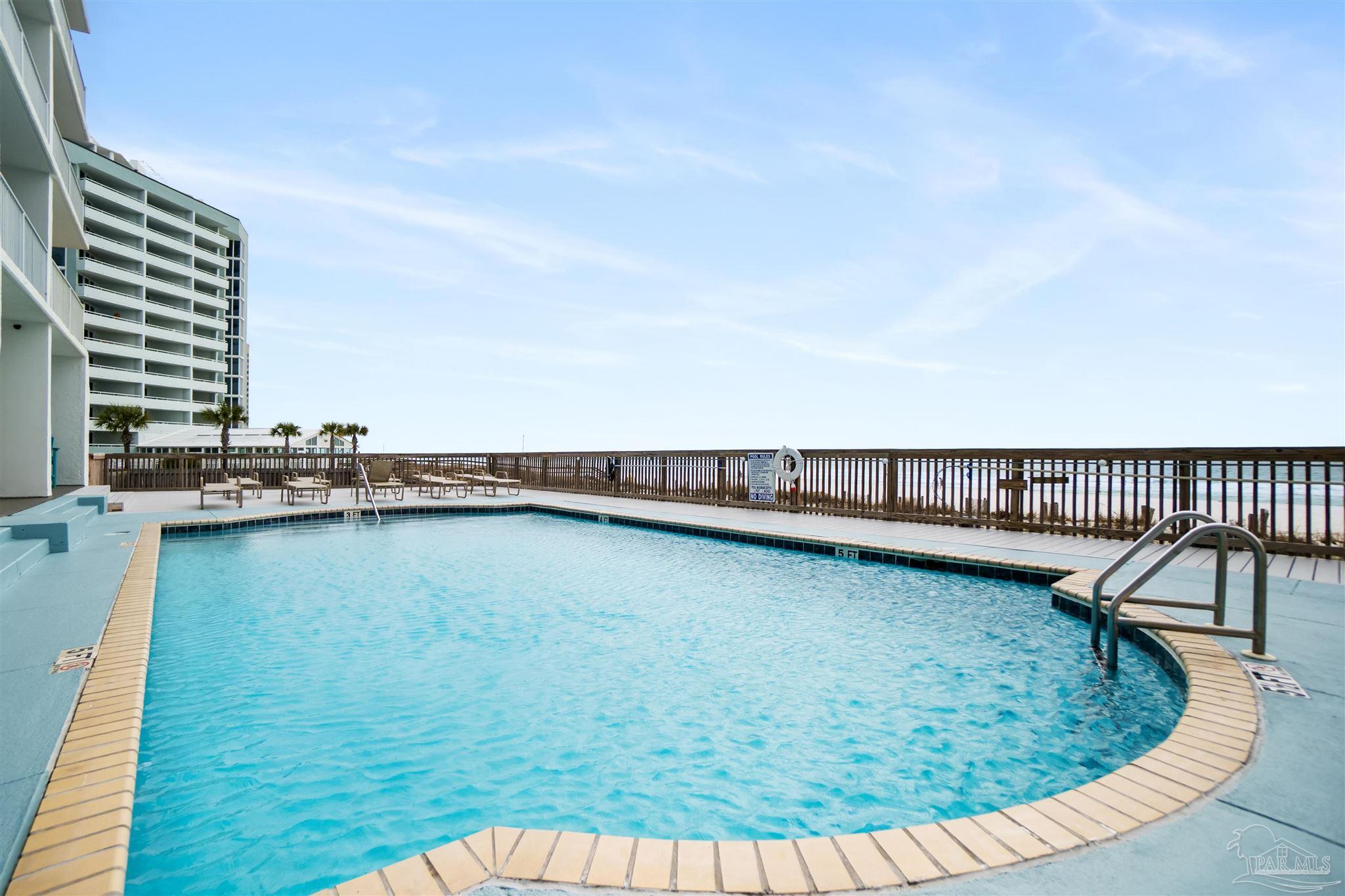 13785 Perdido Key Drive, Unit G3 Perdido Key, FL 32507 - Photo 11 of 30 a view of a swimming pool with a lounge chair