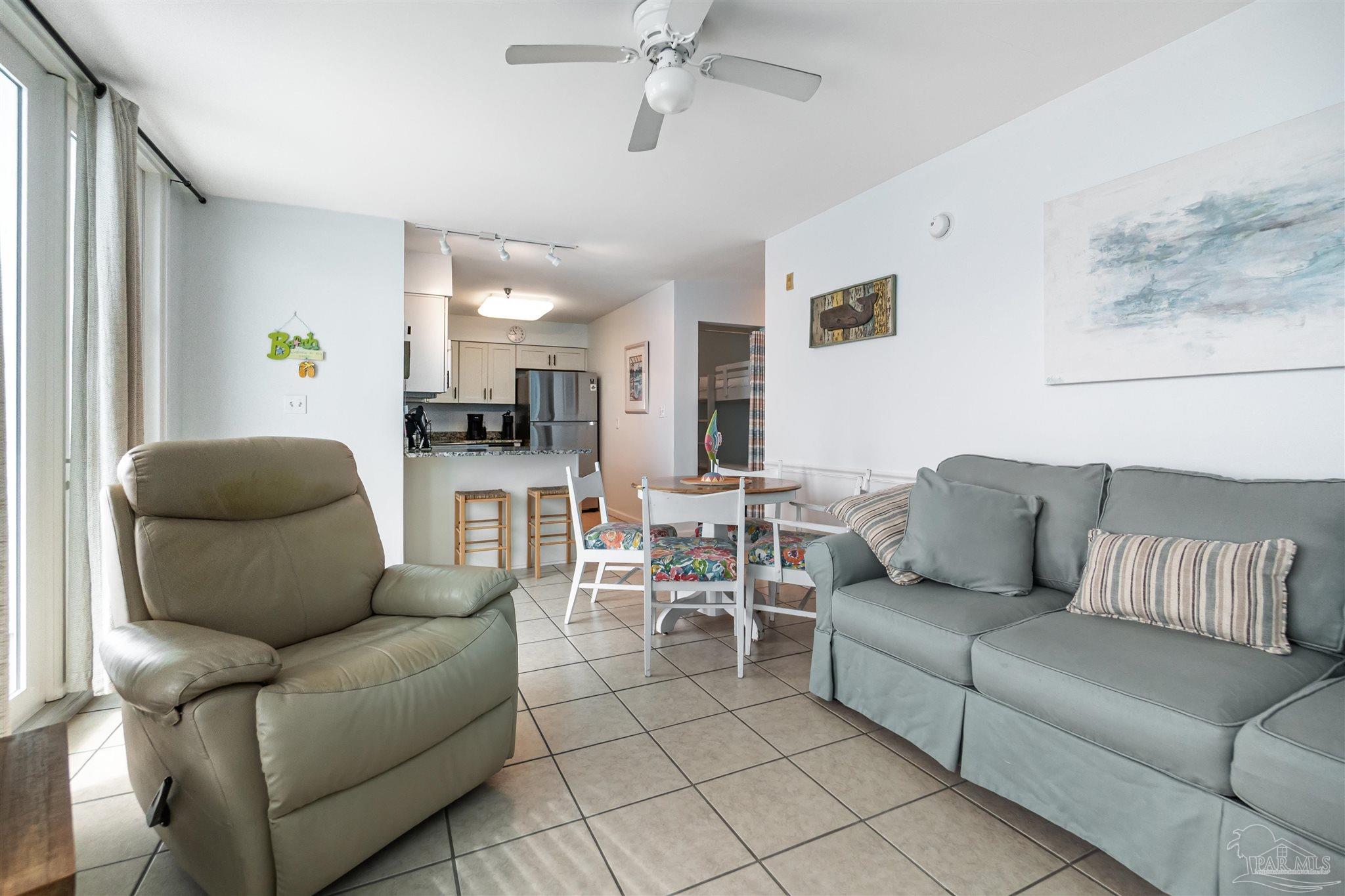 13785 Perdido Key Drive, Unit G3 Perdido Key, FL 32507 - Photo 17 of 30 a living room with furniture and a view of kitchen