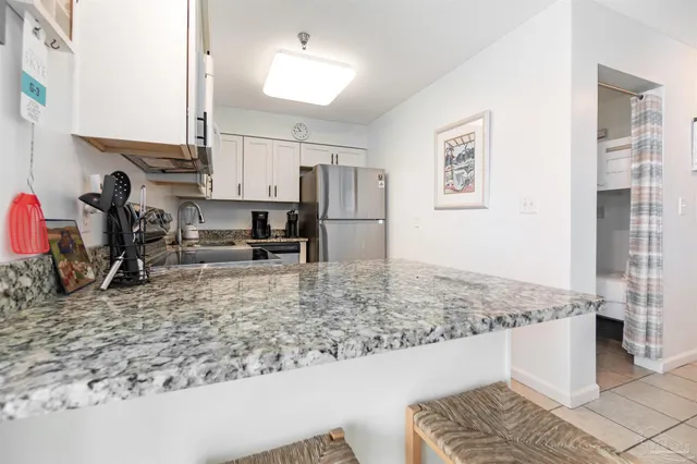 a view of a kitchen counter space and a sink