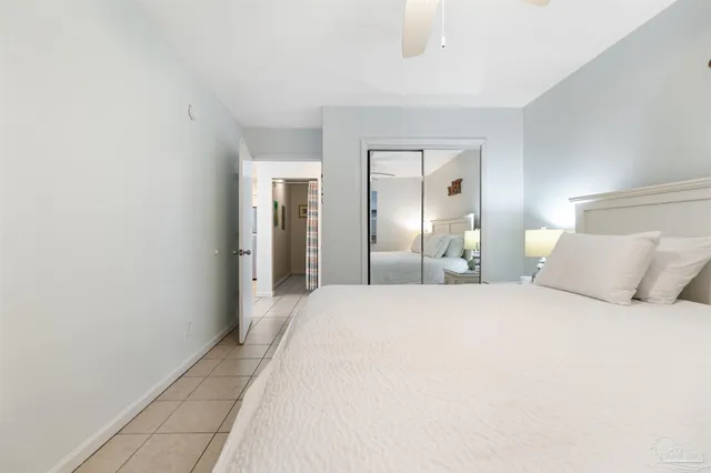 a large white bed in a white room