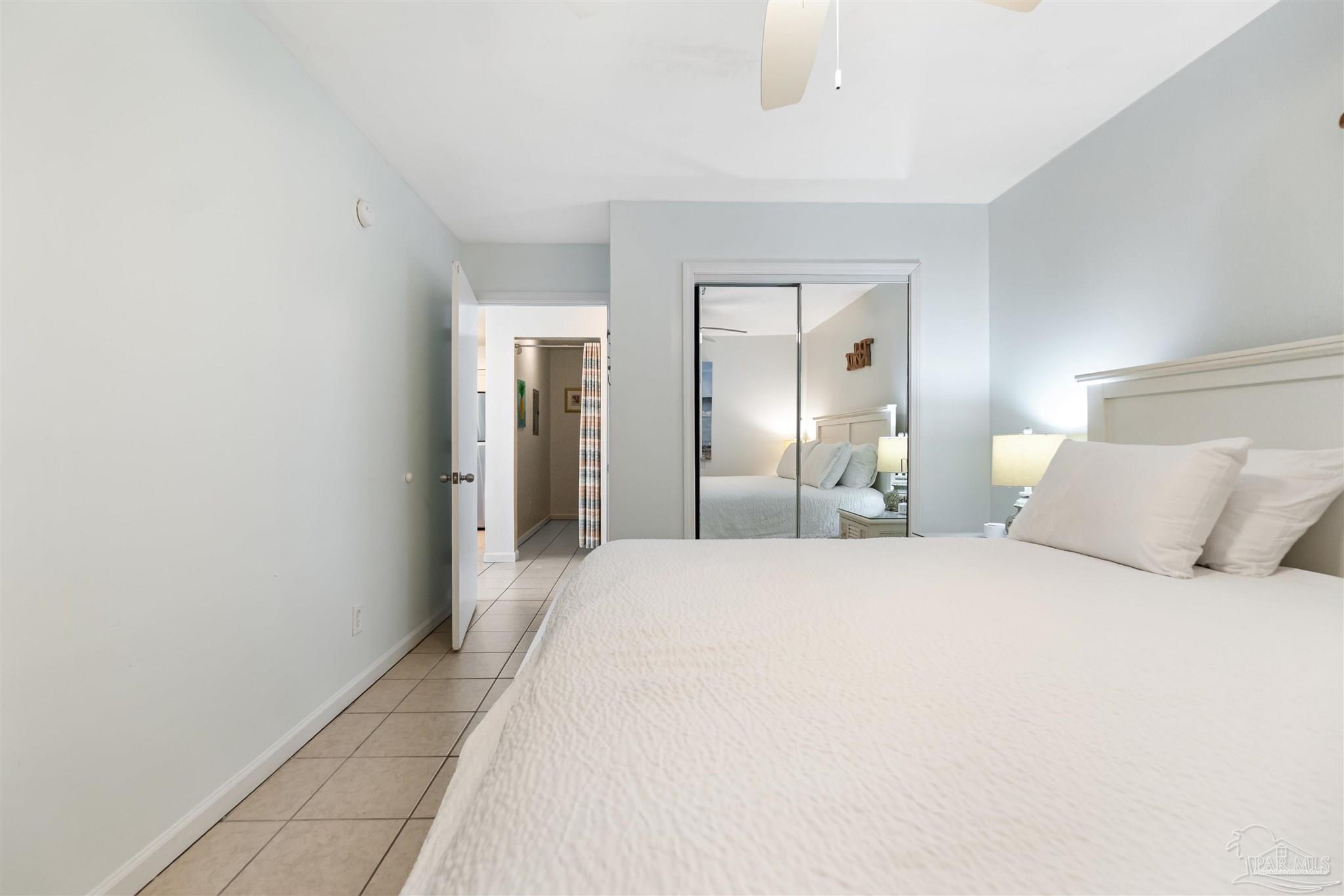 13785 Perdido Key Drive, Unit G3 Perdido Key, FL 32507 - Photo 27 of 30 a large white bed in a white room