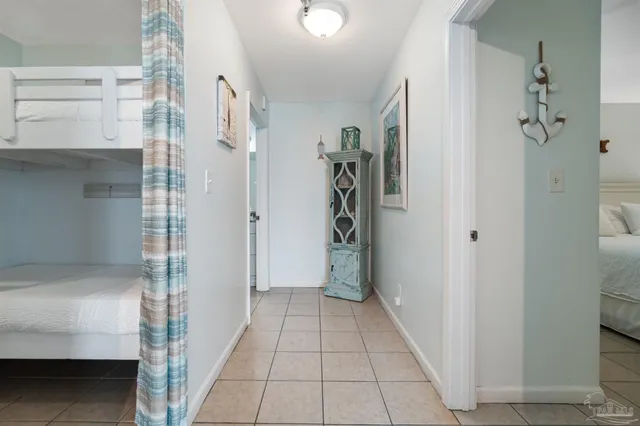 a bathroom with a granite countertop sink a toilet and a shower curtain