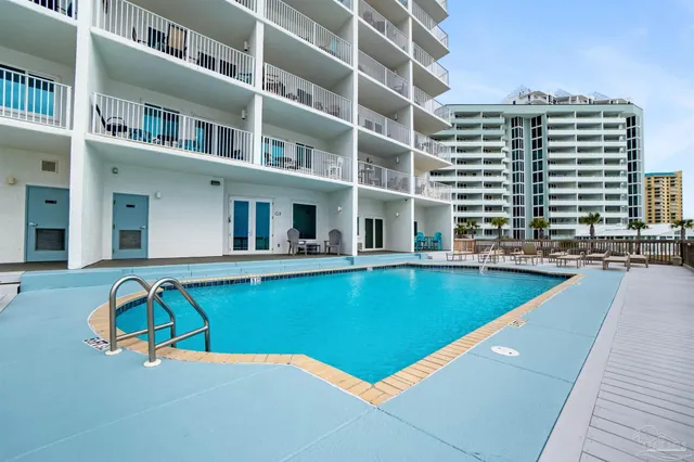 a view of pool with outdoor seating