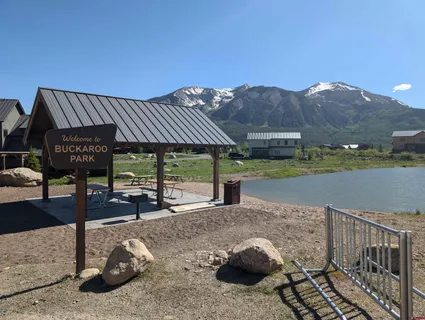 a view of a porch with furniture and a yard