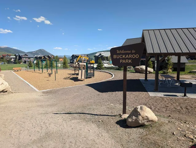 a view of a patio with a table and chairs