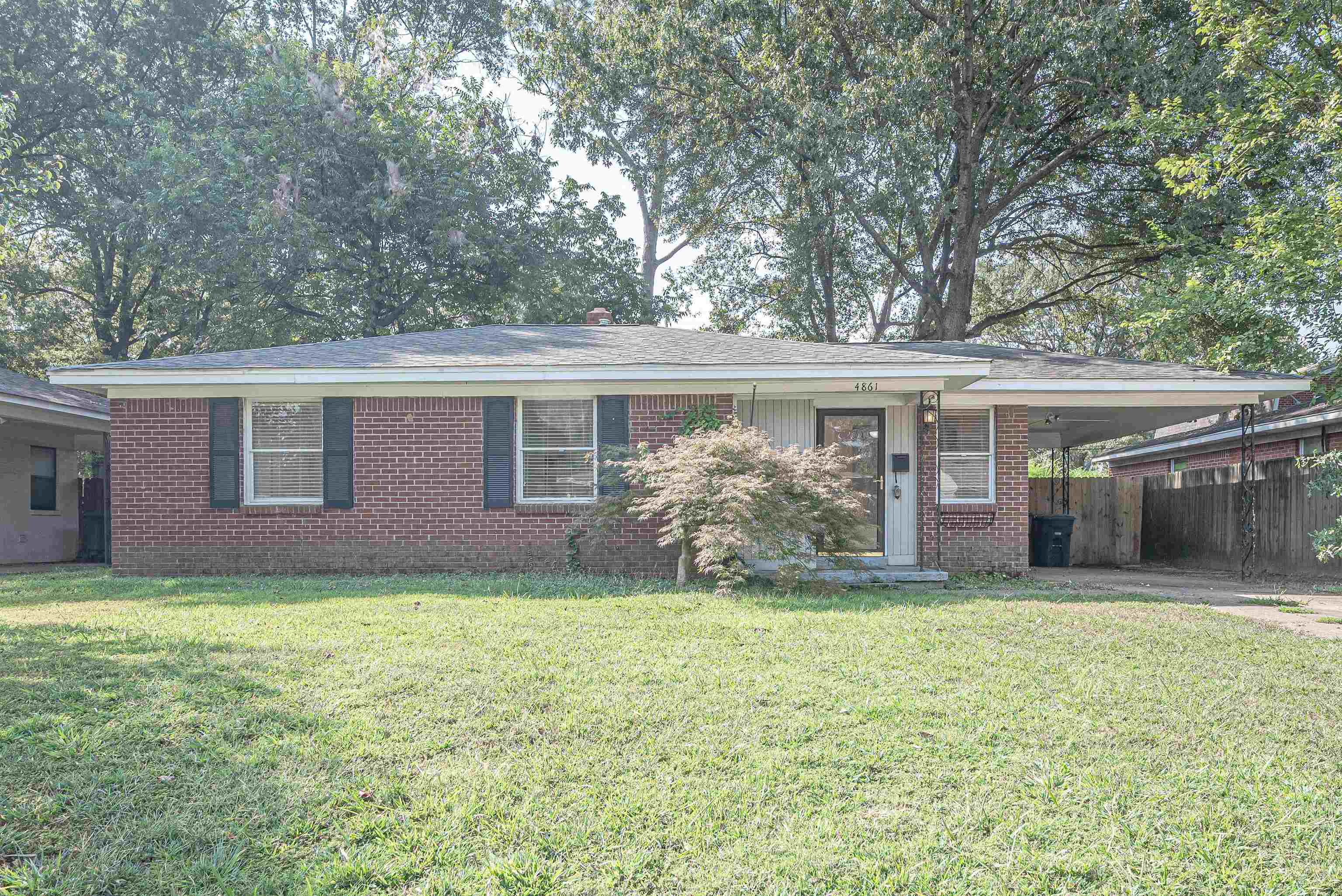 4861 Verne Road Memphis, TN 38117 - Photo 1 of 17 a view of a house with a yard and potted plants