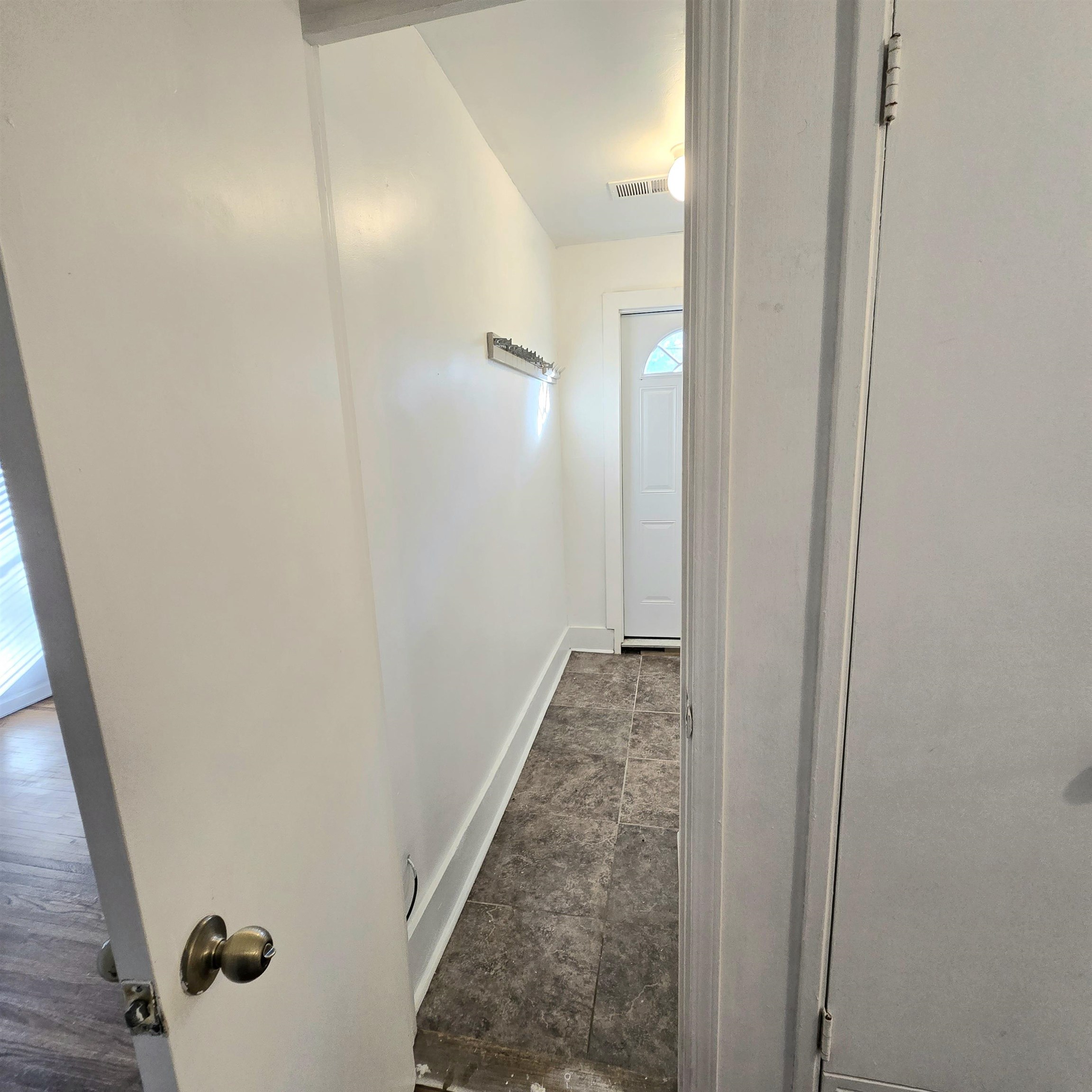 4861 Verne Road Memphis, TN 38117 - Photo 12 of 17 a view of a bathroom from a corridor
