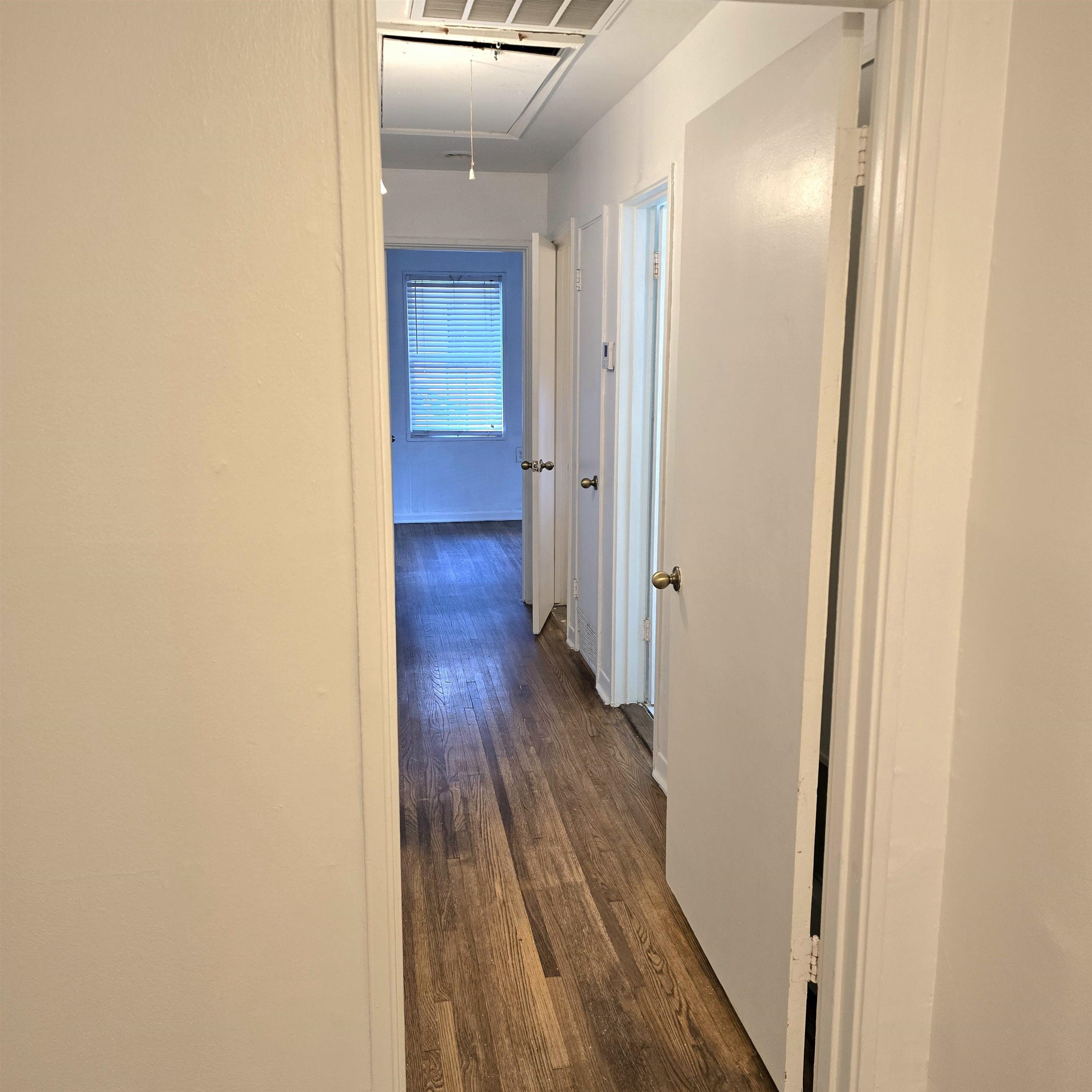 4861 Verne Road Memphis, TN 38117 - Photo 6 of 17 a view of a hallway with wooden floor